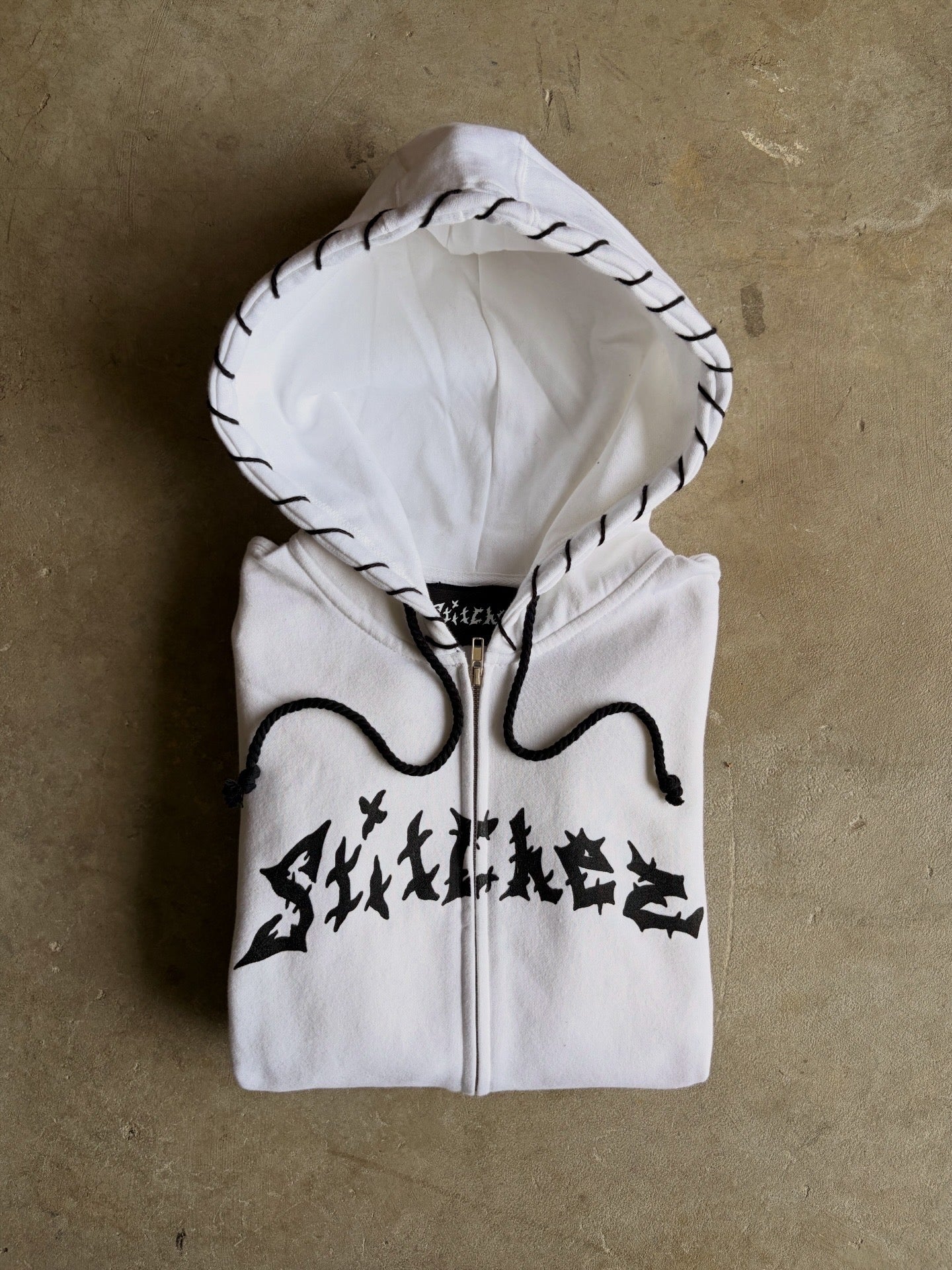 STITCHED ZIP-UPS