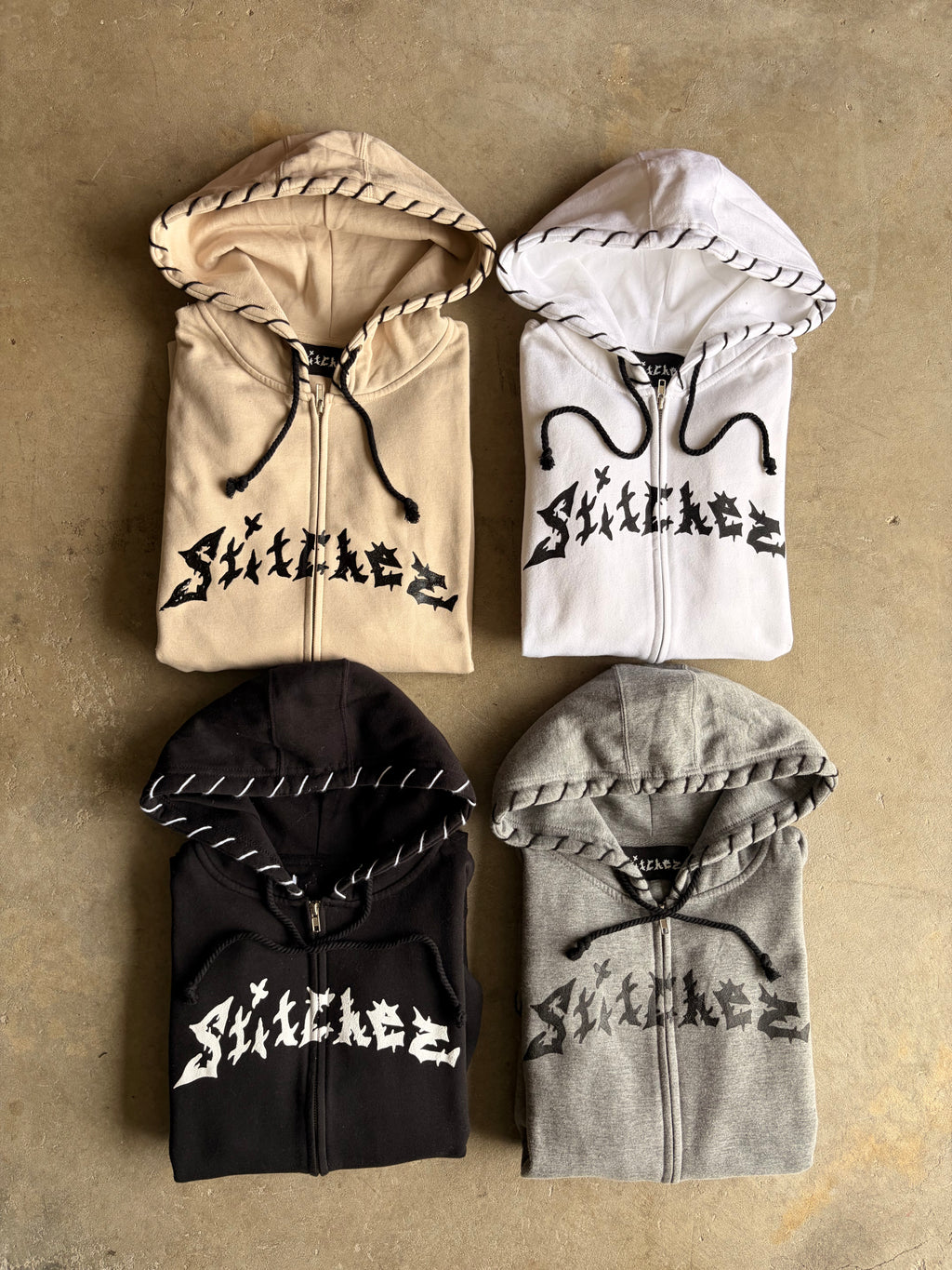 STITCHED ZIP-UPS